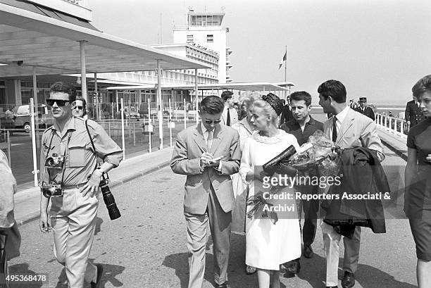 French singer, actress and director Jeanne Moreau and French actor and director Jean-Claude Brialy arriving in Cannes for the 15th Cannes film...