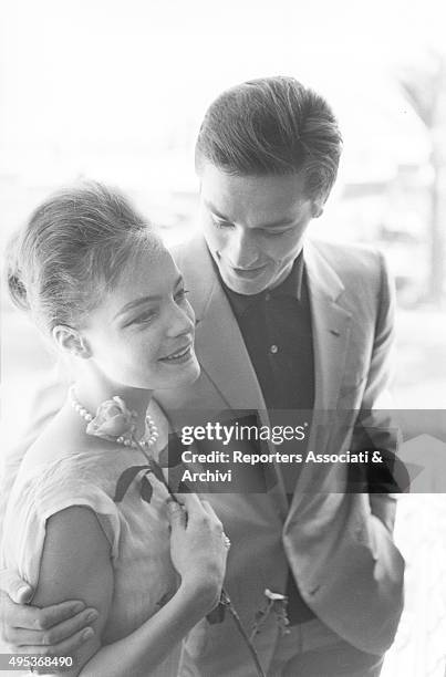 German-born French actress Romy Schneider and French actor, director and singer Alain Delon hugging each other. The couple is in Cannes for the 15th...