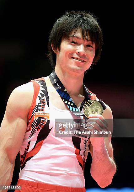 Gold medalist Kohei Uchimura of Japan poses on the podium at the medal ceremony for the Men's All-Around during day eight of the 2015 World Artistic...