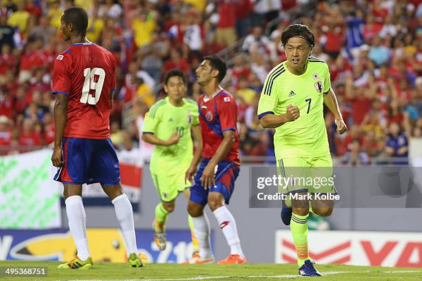 Yasuhito Endo of Japan celebrates scoring a goal during the International Friendly Match between Japan and Costa Rica at Raymond James Stadium on...