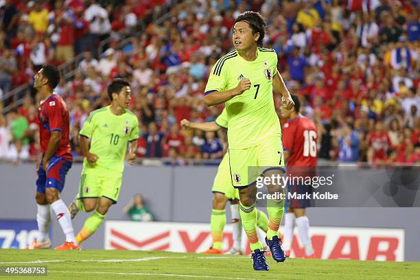 Yasuhito Endo of Japan celebrates scoring a goal during the International Friendly Match between Japan and Costa Rica at Raymond James Stadium on...
