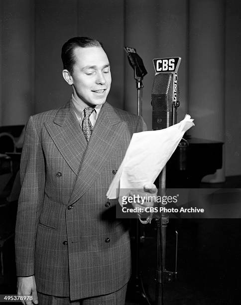 Songwriter Johnny Mercer at a CBS Radio microphone. He performs regularly on The Camel Caravan radio program. January 17, 1939. New York, NY.