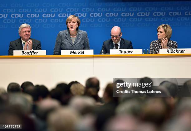 Prime Minister of Hessen Volker Bouffier, Peter Tauber and Julia Kloeckner applaud the German Chancellor and Chairwoman of the German Christian...