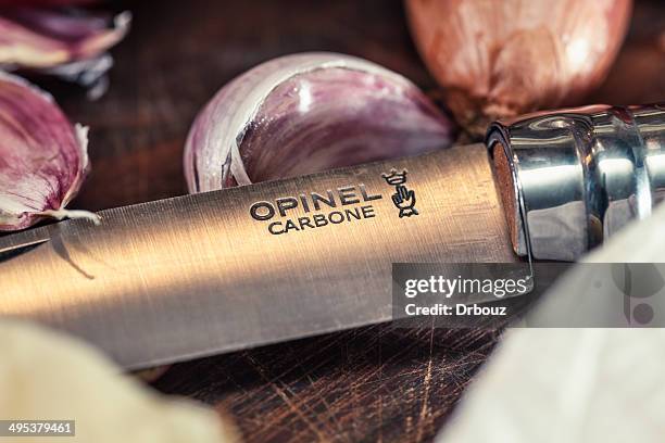 opinel folding knife - arm made of vegetables stock pictures, royalty-free photos & images
