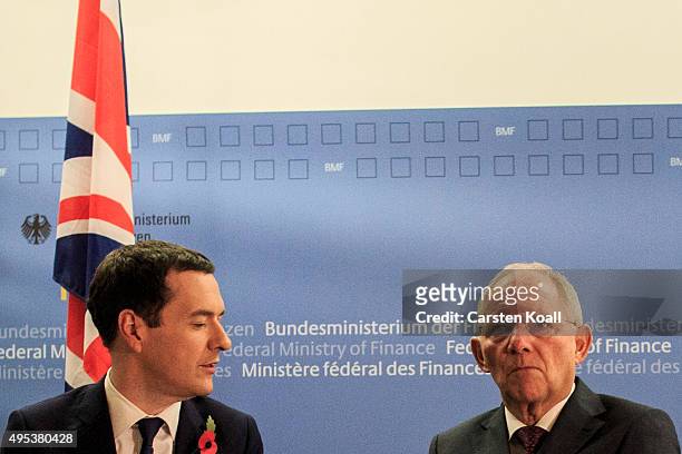 German Finance Minister Wolfgang Schaeuble and British Chancellor of the Exchequer George Osborne pose for the press upon Osborne's arrival at the...