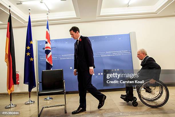 German Finance Minister Wolfgang Schaeuble and British Chancellor of the Exchequer George Osborne attend for a photo call upon Osborne's arrival at...