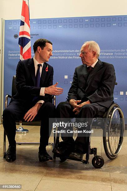 German Finance Minister Wolfgang Schaeuble greets British Chancellor of the Exchequer George Osborne upon Osborne's arrival at the Ministry of...