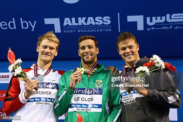 Victor Bromer of Denmark, Chad Le Clos of South Africa and Christopher Wright of Australia celebrate on the podium after the Men's 200m...