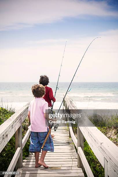 heading to do some surf fishing on the outer banks - surf casting stock pictures, royalty-free photos & images