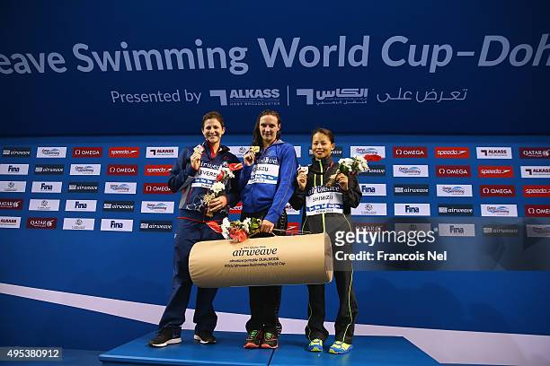 Caitlin Leverenz of USA, Katinka Hosszu of Hungary and Sakiko Shimizu of Japan celebrate on the podium after the Women's 200m Individual Medley final...