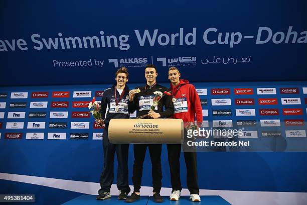 Velimir Stjepanovic of Serbia, James Guy of Great Britain and Stephen Milne of Great Britain celebrate on the podium after the Men's 400m Freestyle...