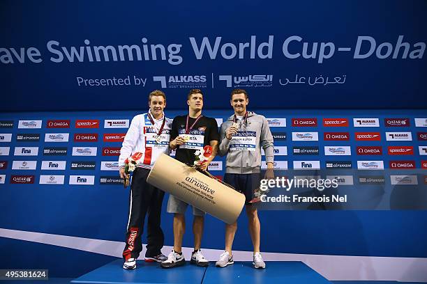 Oleg Kostin of Russia, Daniel Gyurta of Hungary and Cameron Van Der Burgh of South Africa celebrate on the podium after the Men's 200m Breaststroke...