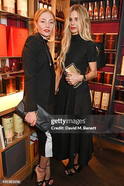 Clara Paget and Laura Bailey attend the launch of La Maison Remy Martin, the cognac brand's new members club, on November 2, 2015 in London, England.