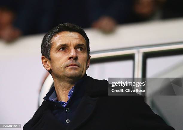 Newly appointed Aston Villa manager Remi Garde looks on from the stands prior to during the Barclays Premier League match between Tottenham Hotspur...