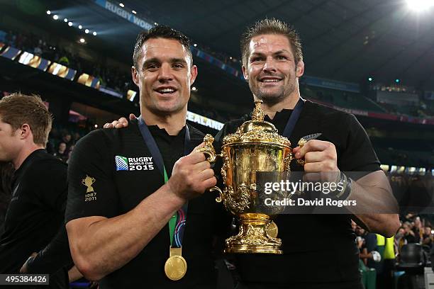 Dan Carter of New Zealand and Richie McCaw of New Zealand pose with the Webb Ellis Cup during the 2015 Rugby World Cup Final match between New...