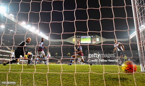 Goalkeeper Brad Guzan of Aston Villa looks on as Dele Alli of Tottenham Hotspur scores their second goal during the Barclays Premier League match...