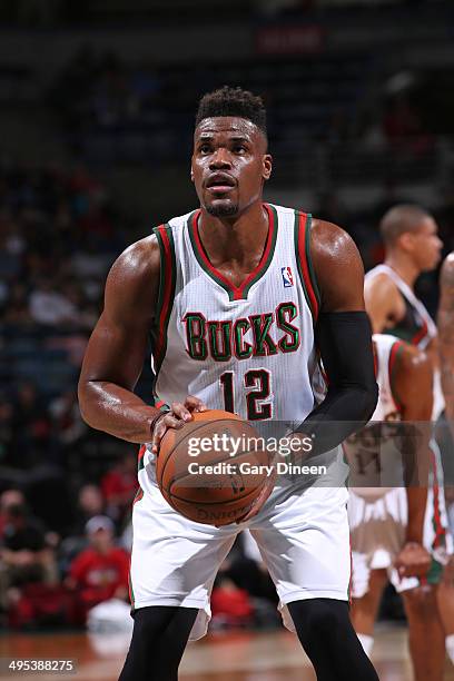 Jeff Adrien of the Milwaukee Bucks shoots a free thow against the Indiana Pacers on April 9, 2014 at the BMO Harris Bradley Center in Milwaukee,...