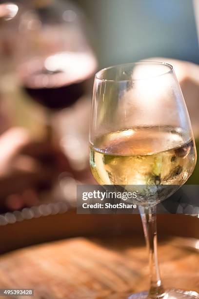 glass with wine on the table - white wine glass bildbanksfoton och bilder