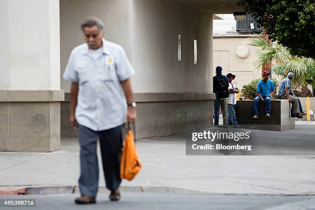 People stand outside the former Rabobank branch in Calexico, California, U.S., on Monday, Oct. 12, 2015. Among Rabobank's 119 branches in California,...