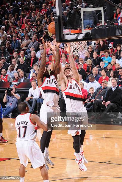 Thomas Robinson and Joel Freeland of the Portland Trail Blazers rebound the ball during the game against the Los Angeles Clippers on April 16, 2014...