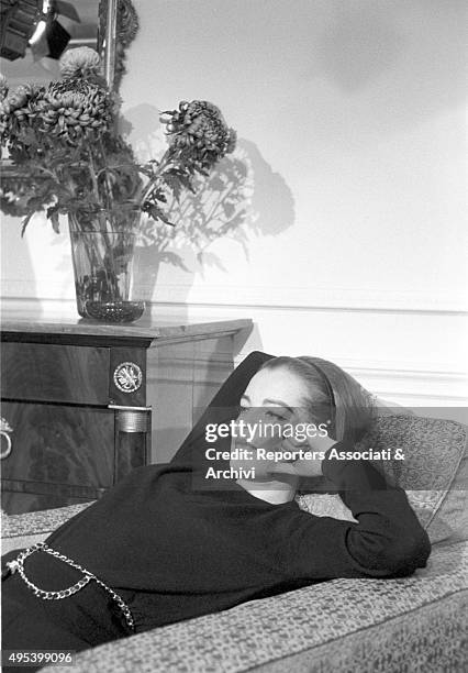 German-born French actress Romy Schneider lying on the bed. London, 18th December 1962