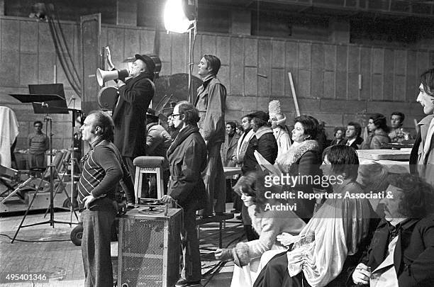 Italian director Federico Fellini shooting a scene from the film Il Casanova by Federico Fellini. Among the people on the set, American singer and...