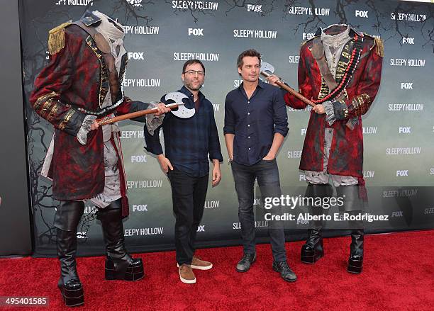 Executive producers Mark Goffman and Len Wiseman pose with headless horsemen at a special screening of Fox's "Sleepy Hollow" at Hollywood Forever on...