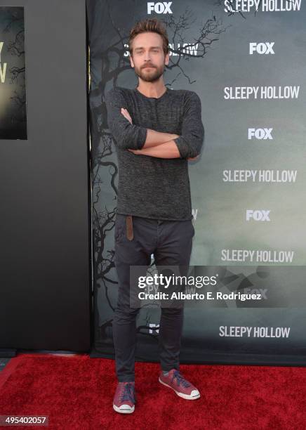 Actor Tom Mison arrives to a special screening of Fox's "Sleepy Hollow" at Hollywood Forever on June 2, 2014 in Hollywood, California.