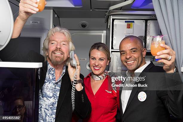 Virgin Group Founder, Sir Richard Branson and Airbnb Chief Marketing Officer, Jonathan Mildenhall give a toast during Virgin America and Airbnb...