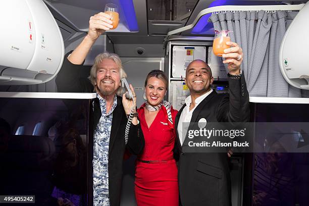 Virgin Group Founder, Sir Richard Branson and Airbnb Chief Marketing Officer, Jonathan Mildenhall give a toast during Virgin America and Airbnb...