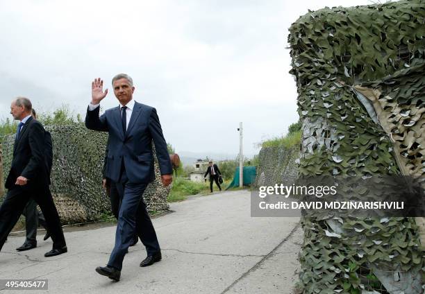 Swiss President and Foreign Minister Didier Burkhalter , who is also chairman of the Organisation for Security and Co-operation in Europe , walks...
