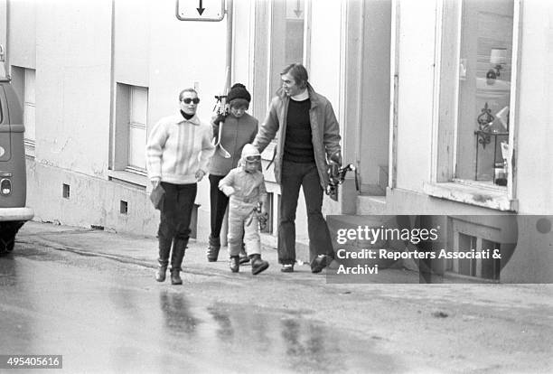 German-born French actress Romy Schneider walking in the city centre with her son David Haubenstock and some other friends. St. Moritz, 1971
