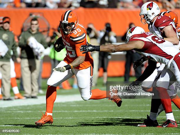 Defensive end Armonty Bryant of the Cleveland Browns returns a fumble recovery down the field during a game against the Arizona Cardinals on November...