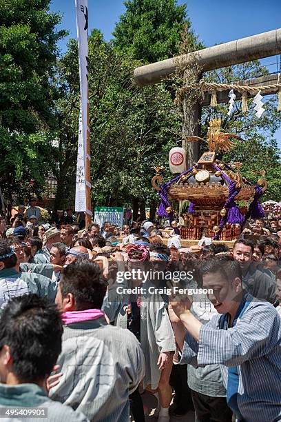 Pilgrims carry a mikoshi or divine palanquin during a Japanese festival. Sanja Matsur , is an annual Shinto festival held in Tokyo. The earliest form...