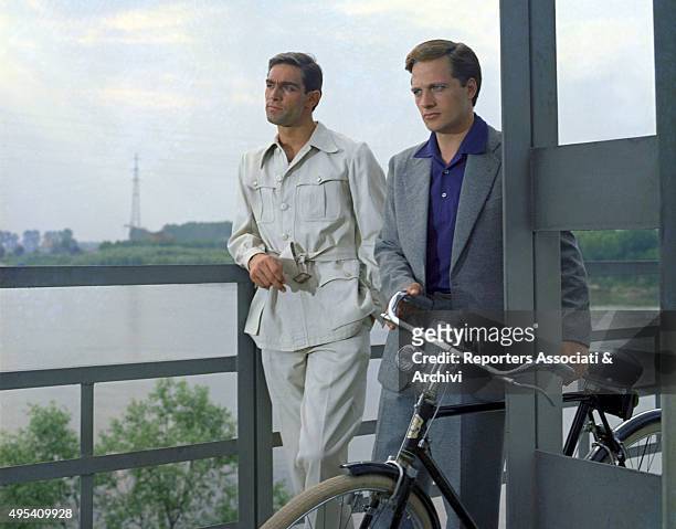 Italian actors Lino Capolicchio and Fabio Testi thoughtful and looking far in a scene from the film The Garden of the Finzi-Continis. Italy, 1970