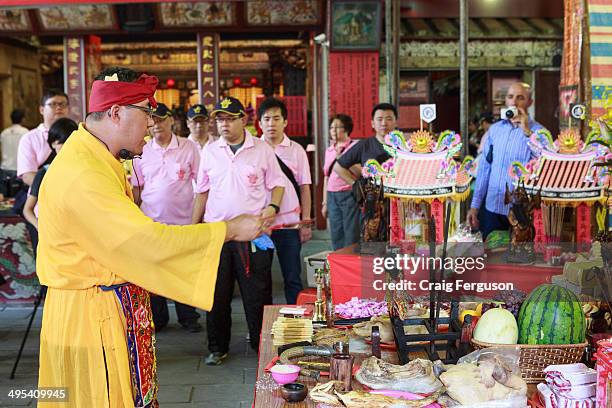 Taoist priest conducts prayers at the start of the Taipei City God birthday celebrations. The 160 year old temple holds an annual celebration every...