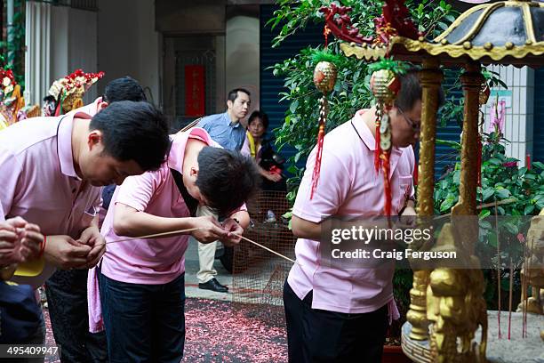 Temple officials pray on the first day of celebrations for the Taipei City God's birthday.