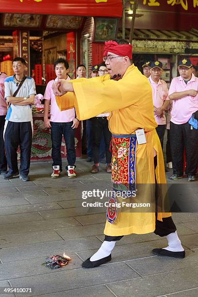 Taoist priest conducts prayers at the start of the Taipei City God birthday celebrations. The 160 year old temple holds an annual celebration every...