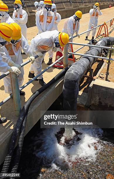 Members of the Fukushima prefectural government's expert committee responsible for monitoring the reactor decommissioning effort at the plant,...