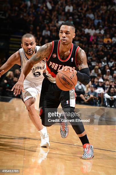 Damian Lillard of the Portland Trail Blazers drives to the basket against Tony Parker of the San Antonio Spurs in Game Two of the Western Conference...