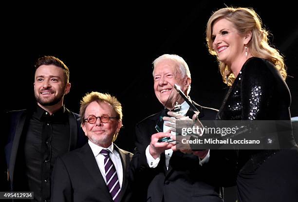 Justin Timberlake, ASCAP President and Chairman of the Board Paul Williams, and President Jimmy Carter present Trisha Yearwood with the Voice of...