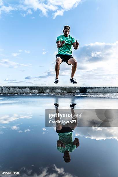 fitness and exercising - mens field event stockfoto's en -beelden