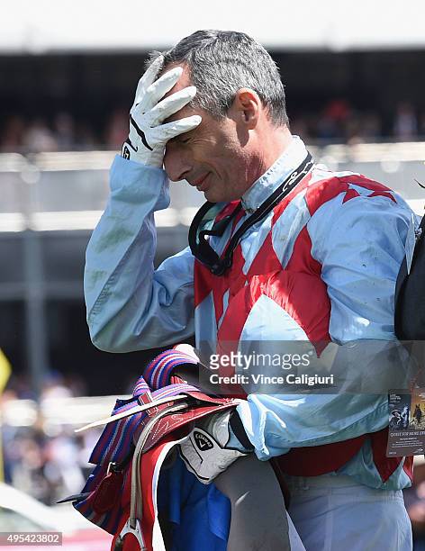 Gerald Mosse is emotional after his horse Red Cadeaux broke down in race 7, the Emirates Melbourne Cup on Melbourne Cup Day at Flemington Racecourse...