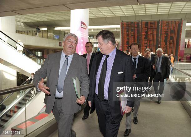 French airport operator Aeroports de Paris CEO Augustin de Romanet listens to French Junior Minister for Transport, Maritime and Fishery, Frederic...