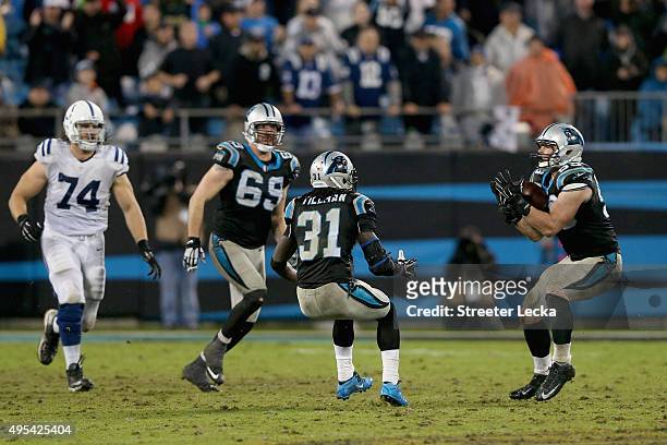 Luke Kuechly of the Carolina Panthers catches an inteception in overtime against the Indianapolis Colts during their game at Bank of America Stadium...