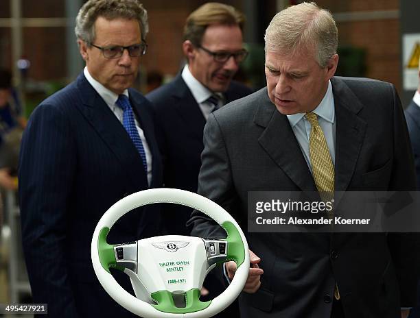Prince Andrew, Duke of York, is pictured during his visit to Volkswagen car plant on June 03, 2014 in Wolfsburg, Germany. The Prince is participating...