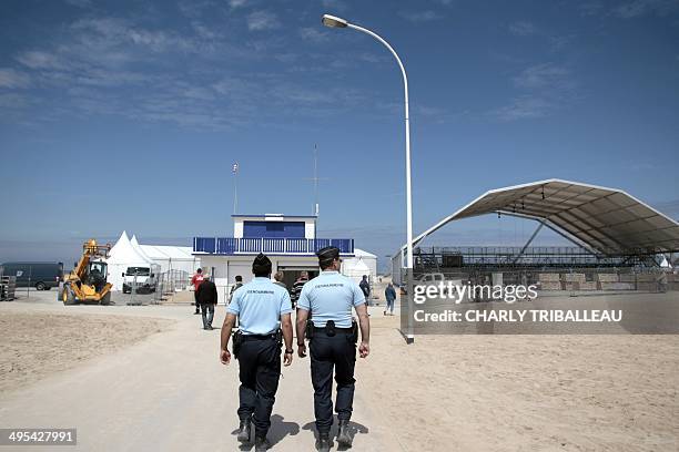 French Gendarmes patrol on the Ouistreham beach, northwestern France, on June 3, 2014 ahead of the 70th anniversary of the D-Day landings in...