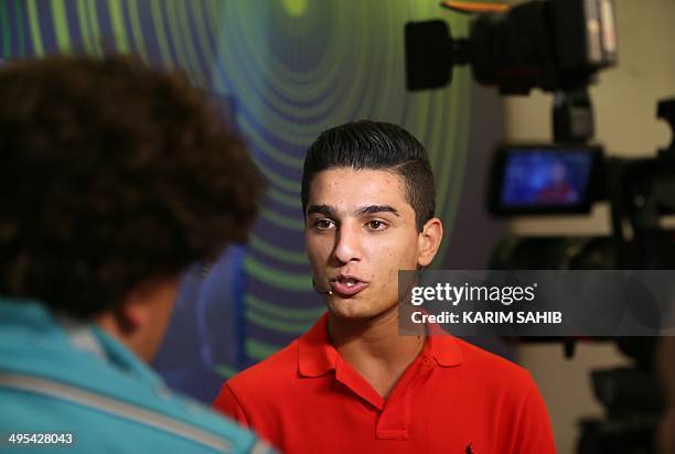 Palestinian singer and winner of "Arab Idol", Mohammed Assaf, speaks to AFP in a record studio in Dubai on June 3, 2014 prior to recording his new...