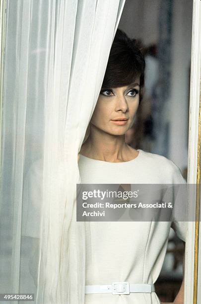 British actress Audrey Hepburn looking out of the window in the film How to Steal a Million. 1966