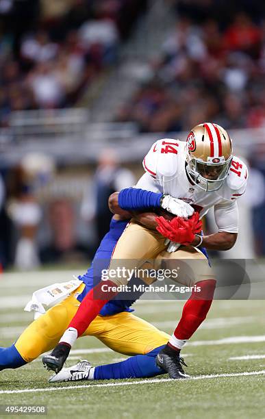 Jerome Simpson of the San Francisco 49ers gets tackled after making a reception during the game against the St. Louis Rams at the Edward Jones Dome...